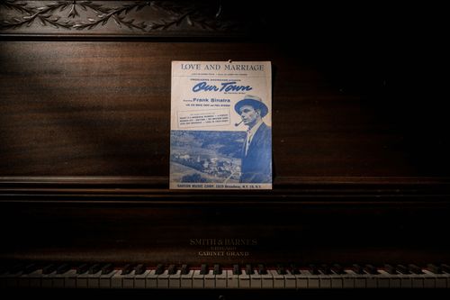 Free A classic Smith & Barnes piano featuring vintage Frank Sinatra sheet music. Stock Photo