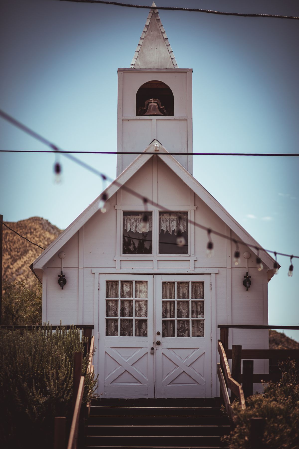 Stock photograph of a white church with a traditional steeple