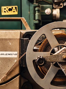 Detailed view of a vintage Super 8 film projector, showcasing its mechanical components and classic design.
