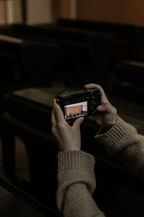 Photo Of Person Holding Camera