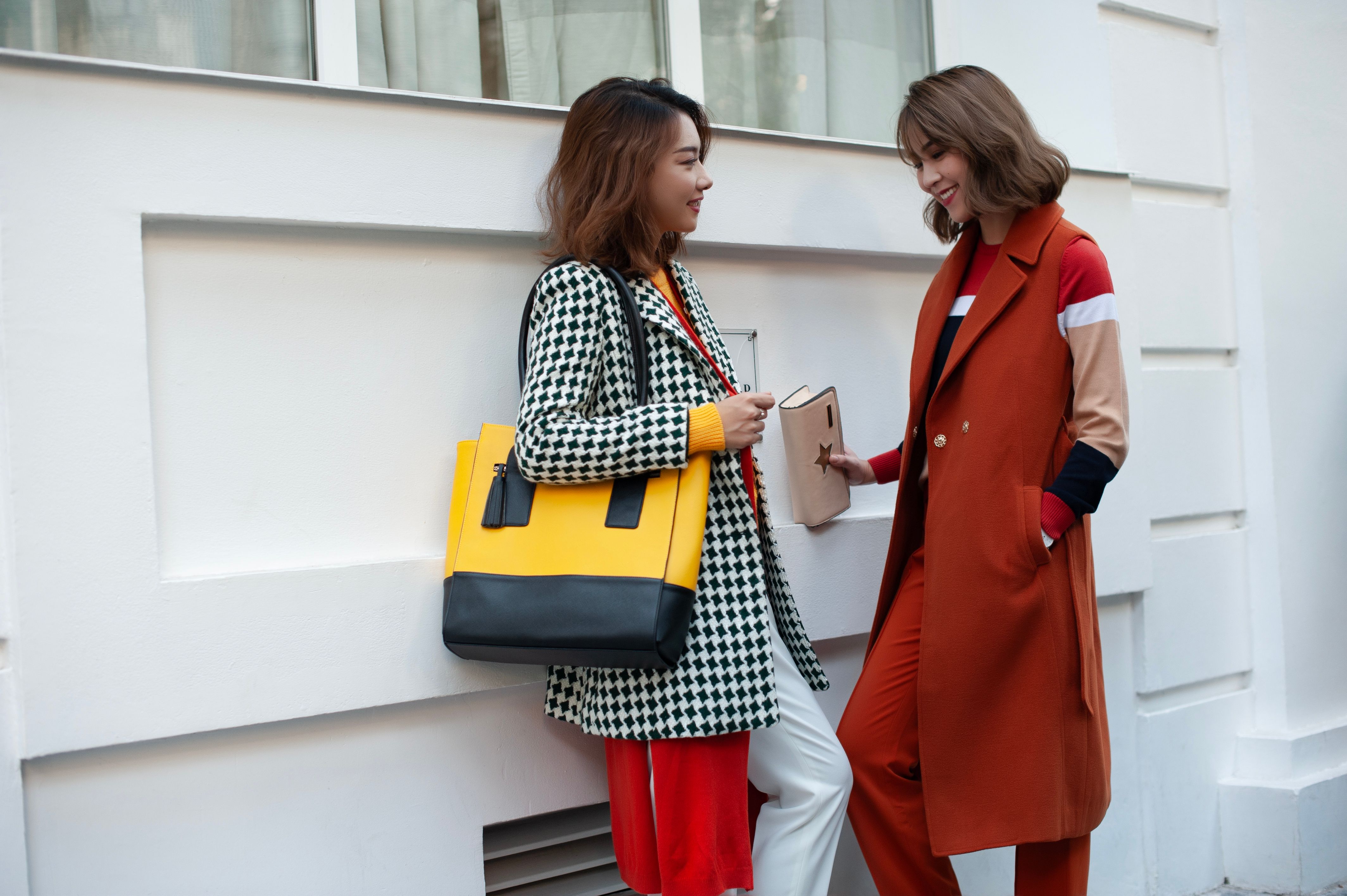 Fashionable Friends Chatting on City Street