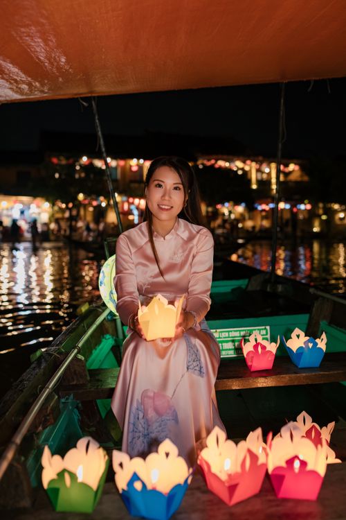 Woman in Áo Dài Holding Lantern in Hội An at Night · Free Stock Photo
