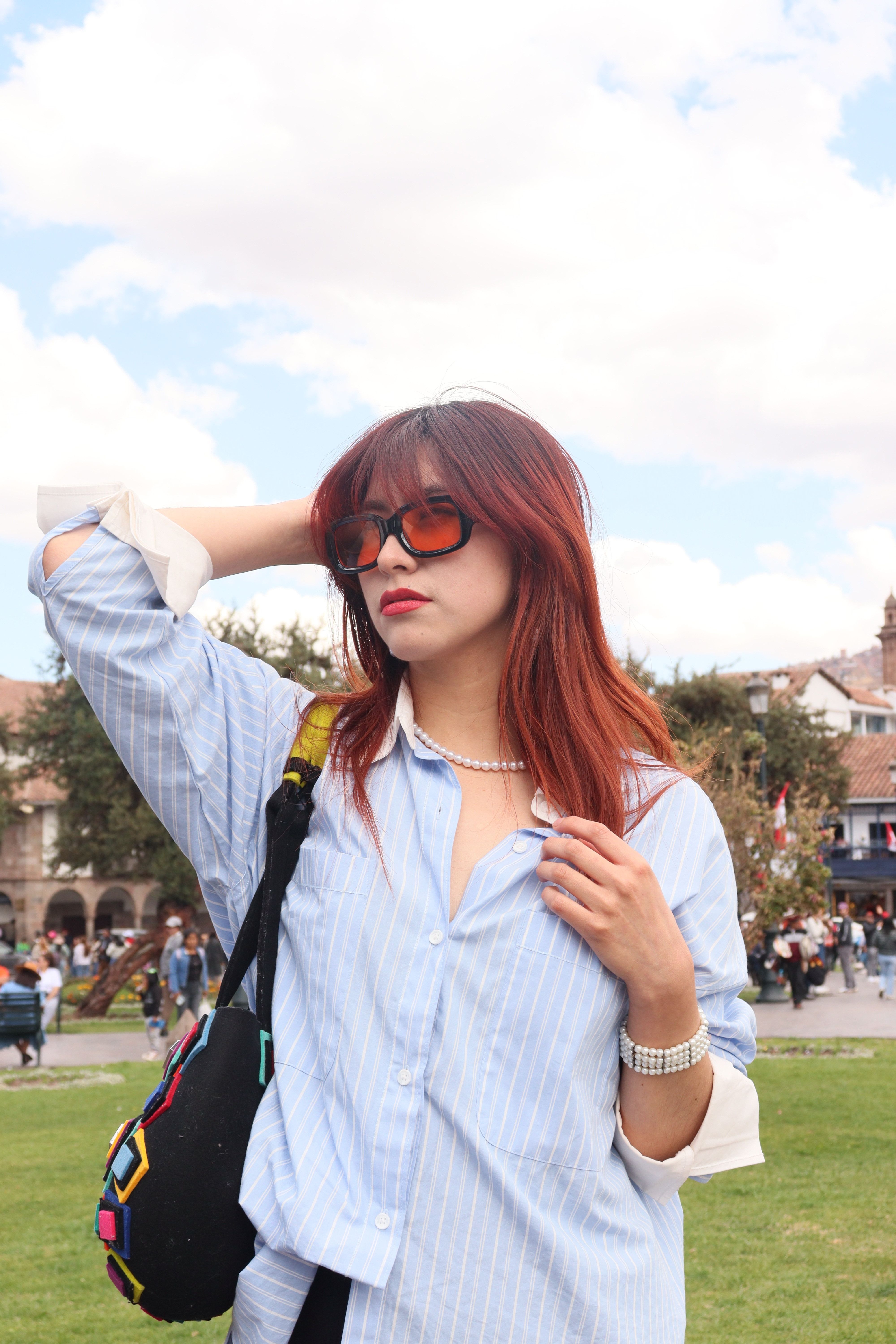 Fashionable woman posing outdoors in urban park · Free Stock Photo