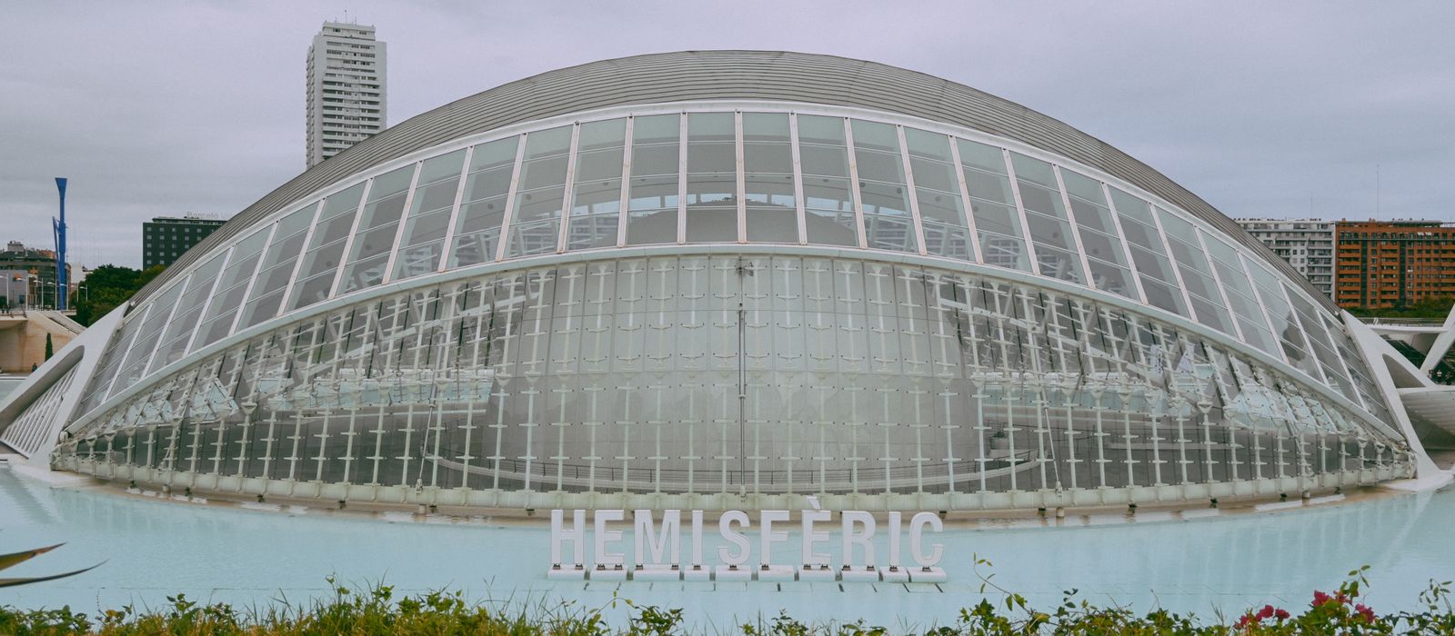 Iconic Hemisferic at City of Arts and Sciences in Valencia, showcasing modern architectural design.