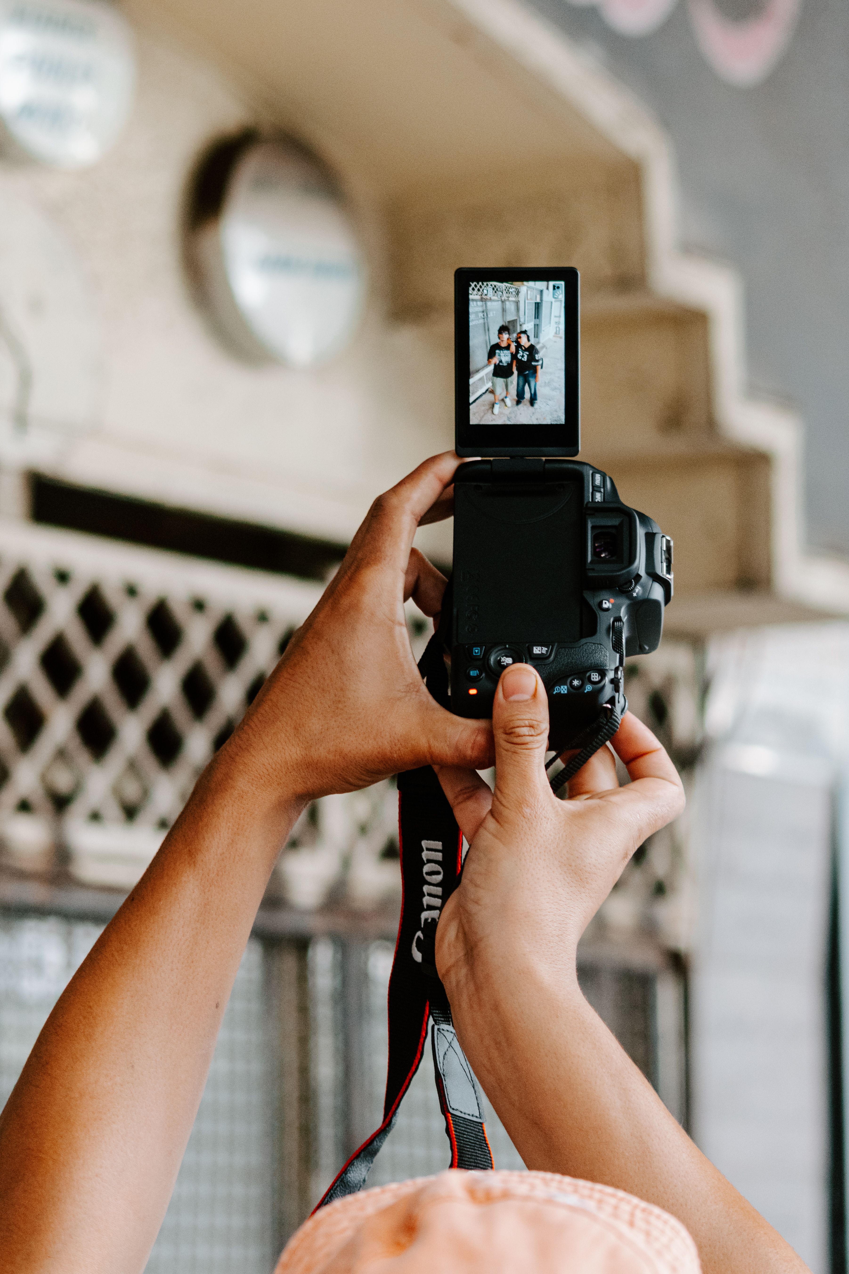 A photographer captures candid moments in Rabat with a DSLR camera.