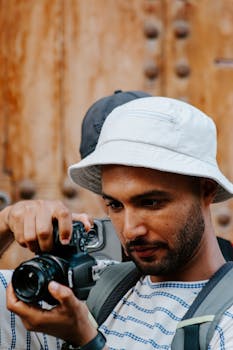 A man capturing street scenes in Rabat, Morocco, with a camera.