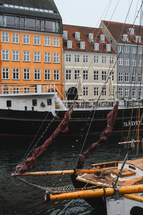 Free Colorful buildings and boats along the picturesque Copenhagen waterfront. Stock Photo