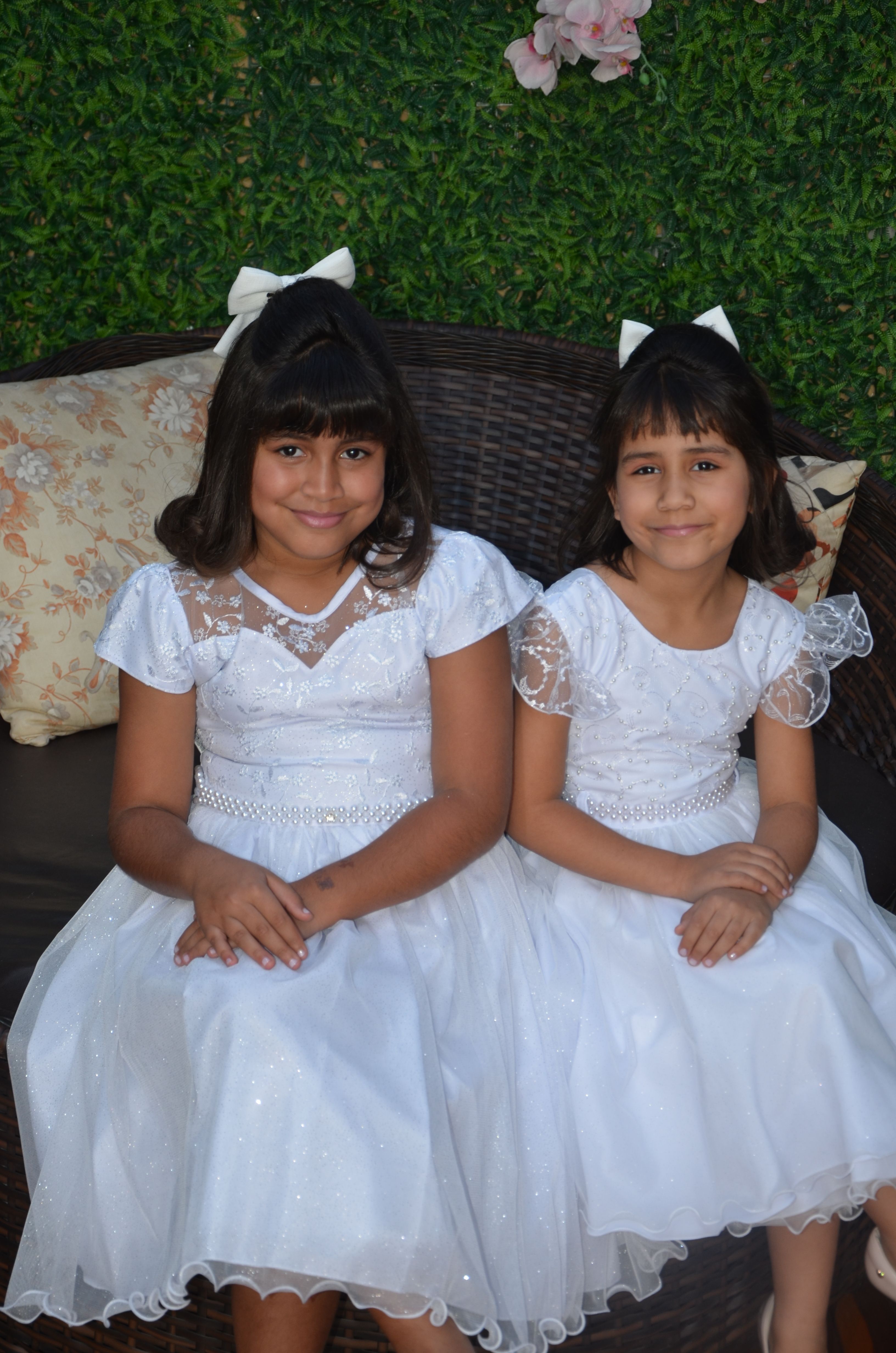 Two Girls in White Dresses Sitting Outdoors · Free Stock Photo