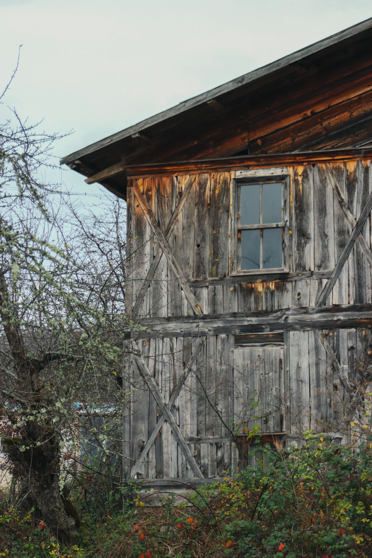 Weathered exterior wood on an old wooden structure before reconditioning