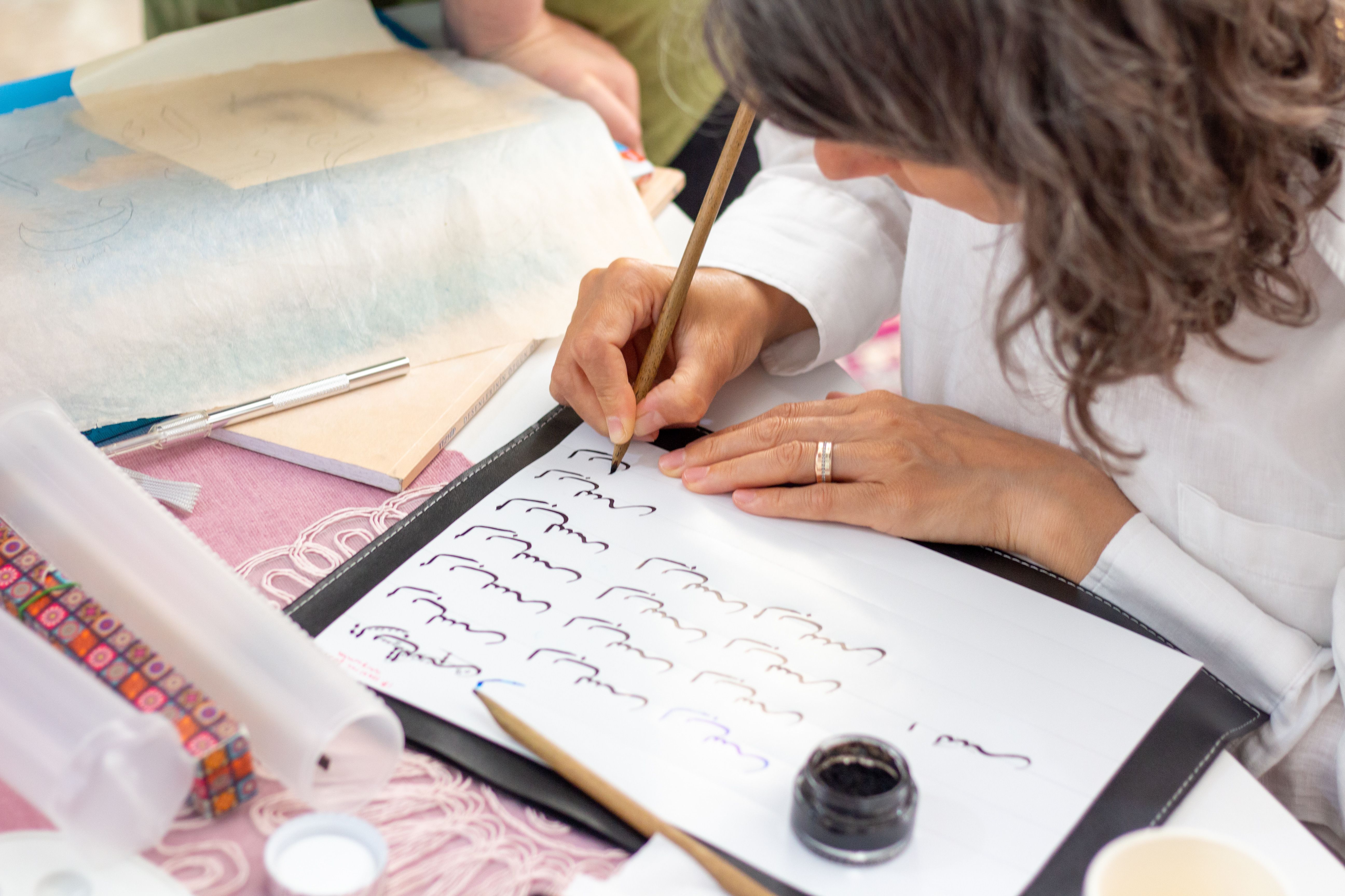 Artistic Calligrapher Writing Elegant Letters · Free Stock Photo