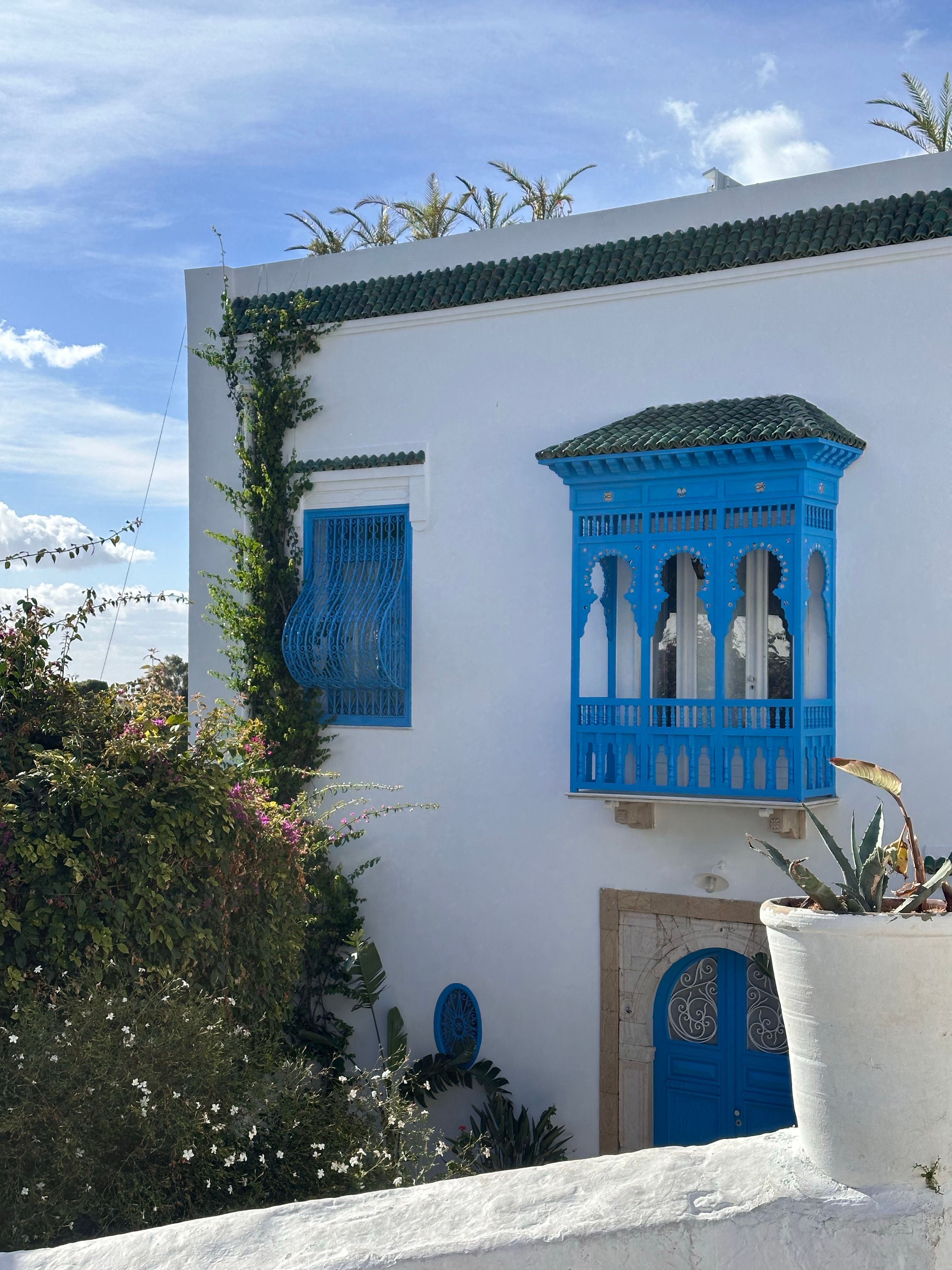 Charming Mediterranean Blue Door and Window Frame · Free Stock Photo