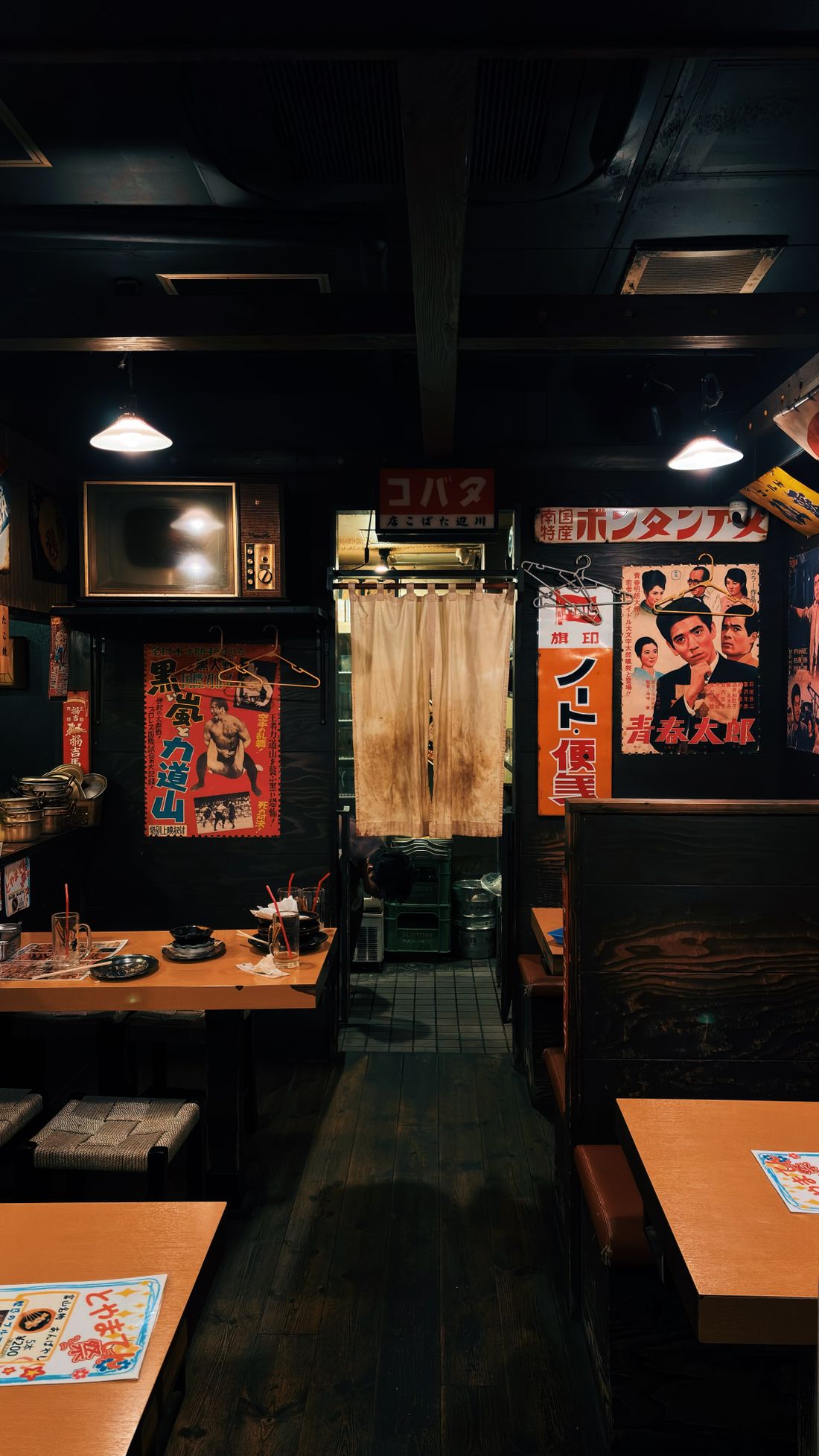 Moody lantern-lit izakaya interior
