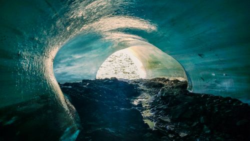 Free A mesmerizing shot of a cave interior in Peru, highlighting the sunlit exit and rocky ground. Stock Photo