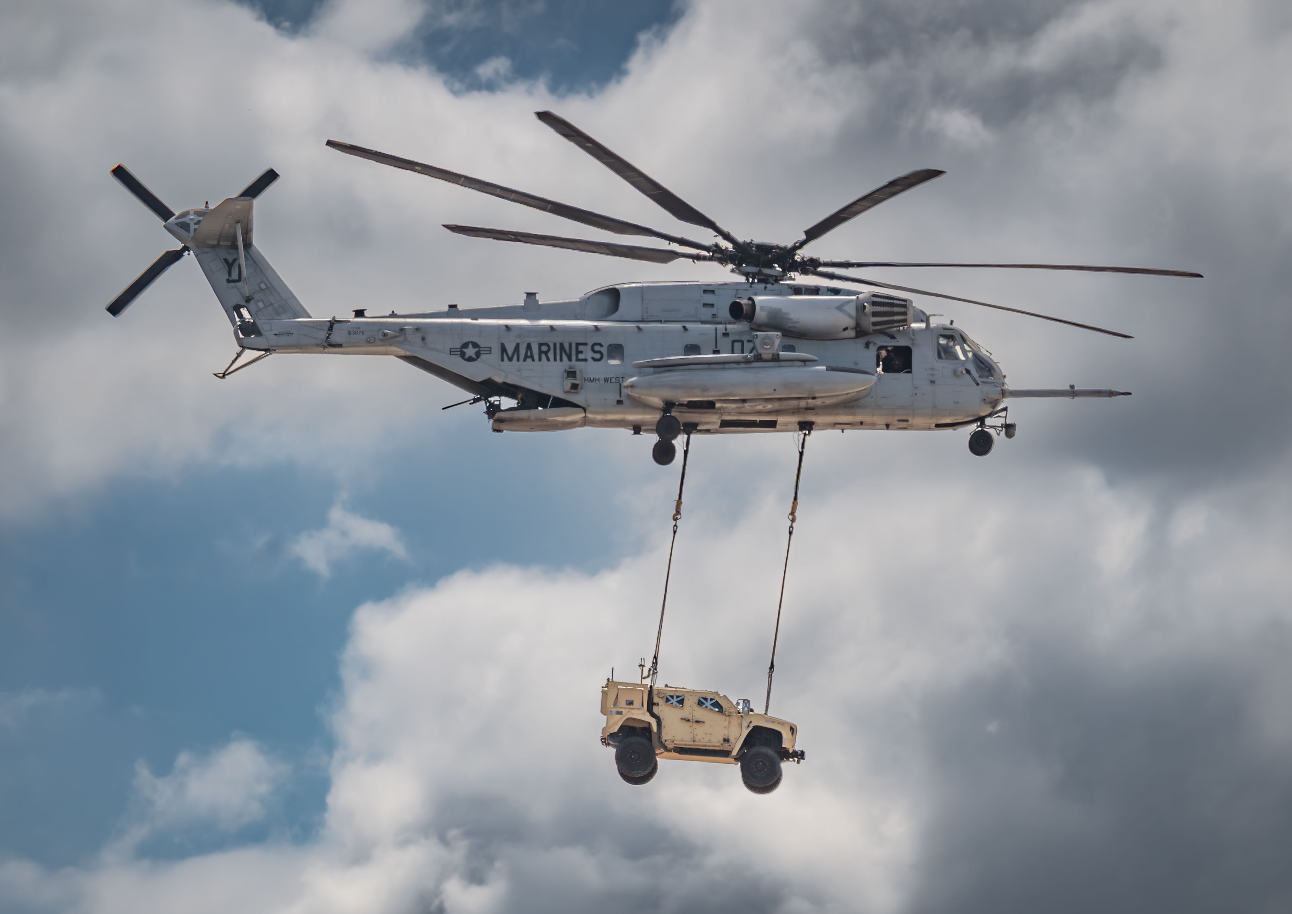 Sikorsky CH-53E Helicopter Lifting a Military Vehicle · Free Stock Photo