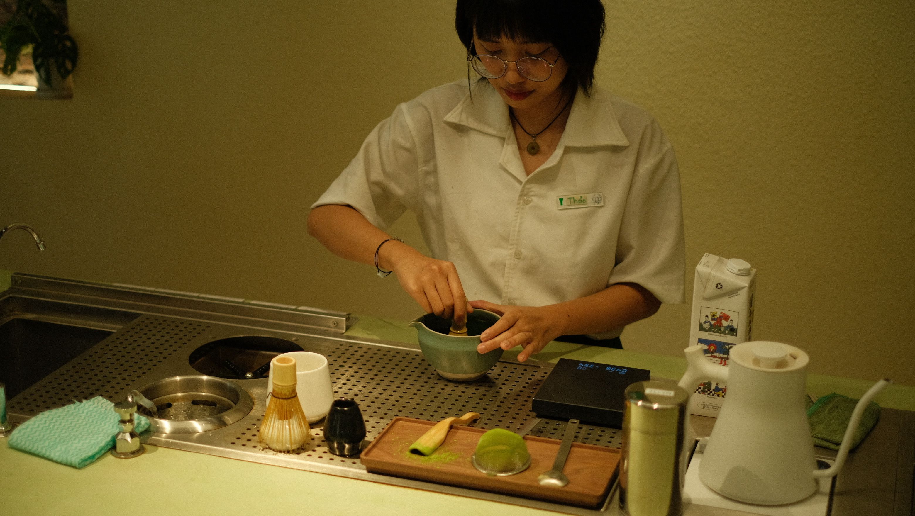 Ceremonial-grade matcha being whisked at the Mayfair Espresso Cafe matcha bar