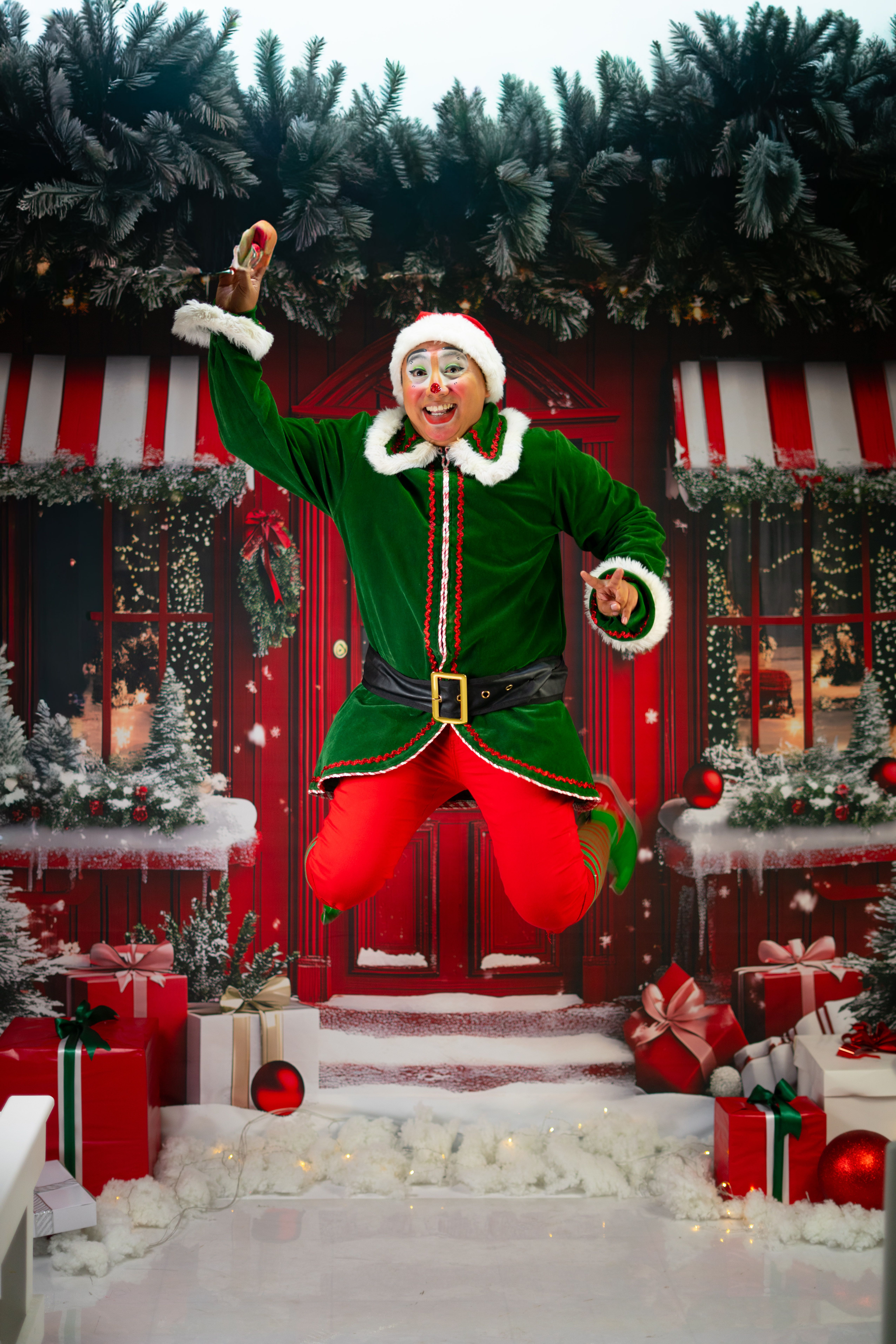Festive Jumping Elf in Holiday Winter Setting · Free Stock Photo
