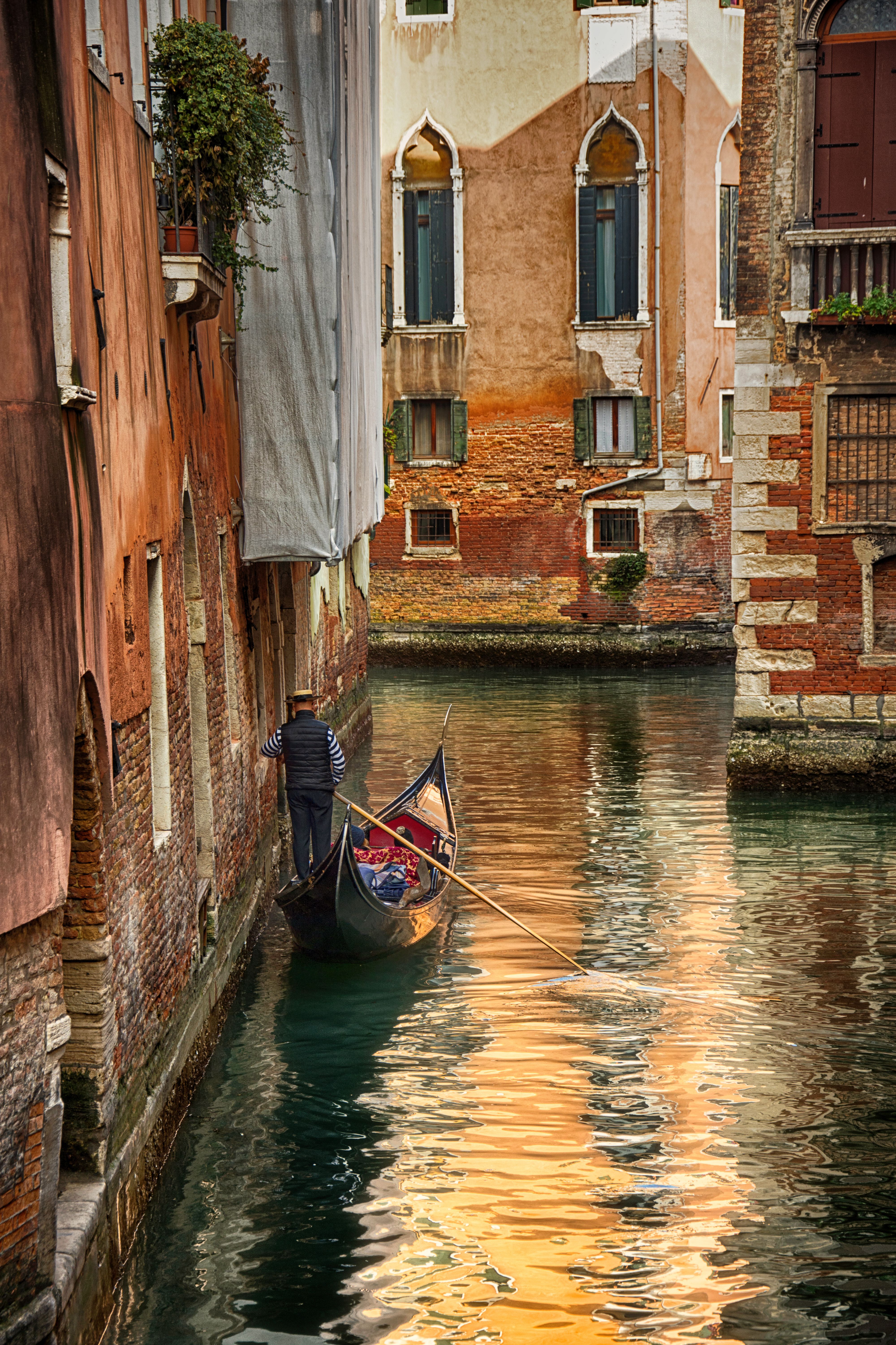 Gondola in Venetian Canal at Sunset · Free Stock Photo