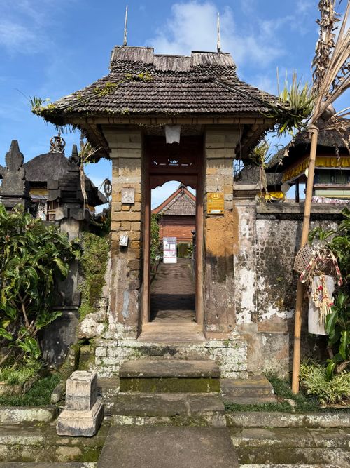 Free Discover the intricate details of a traditional Balinese temple gate under a clear blue sky. Stock Photo