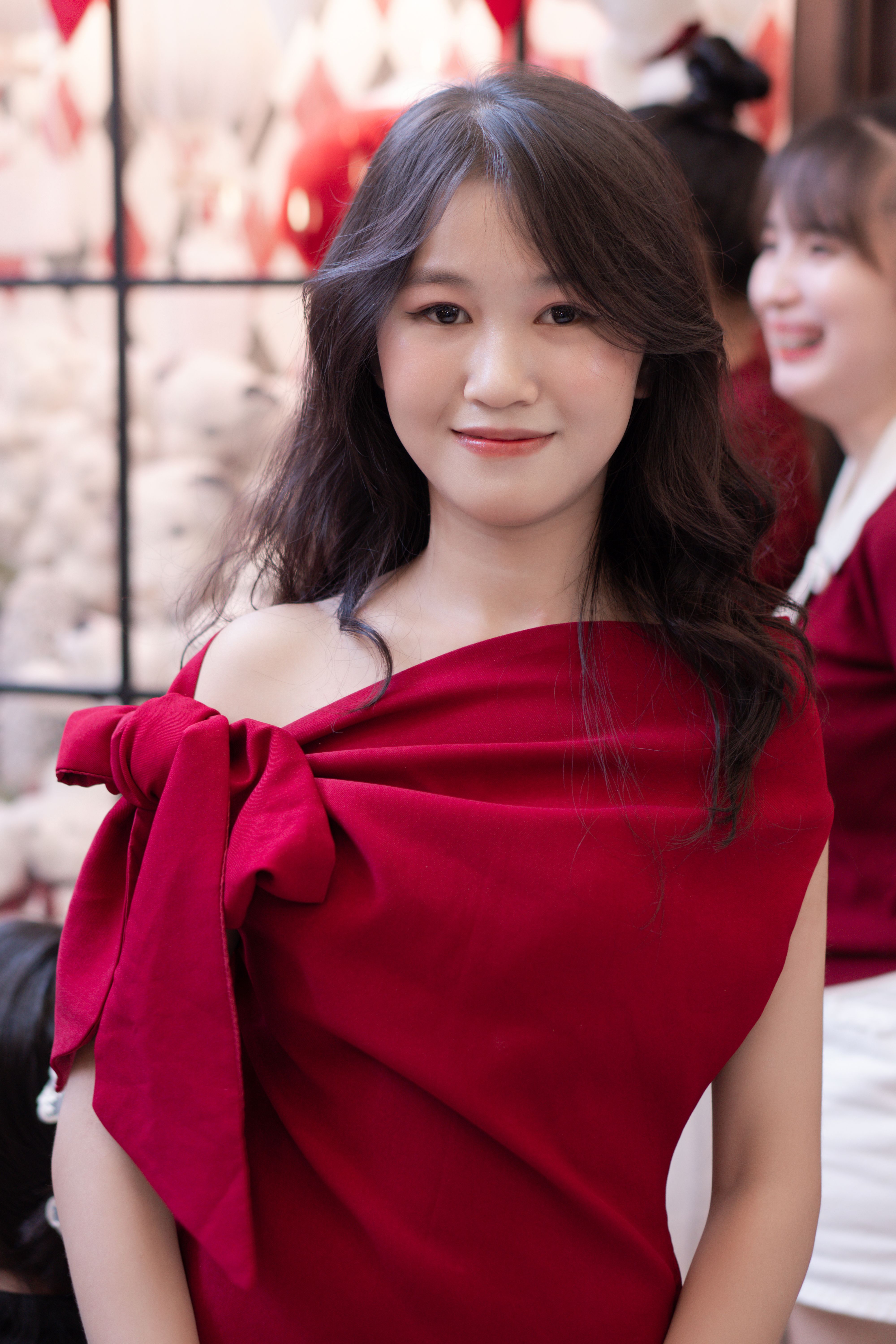 Elegant Woman in Red Dress at Indoor Event · Free Stock Photo