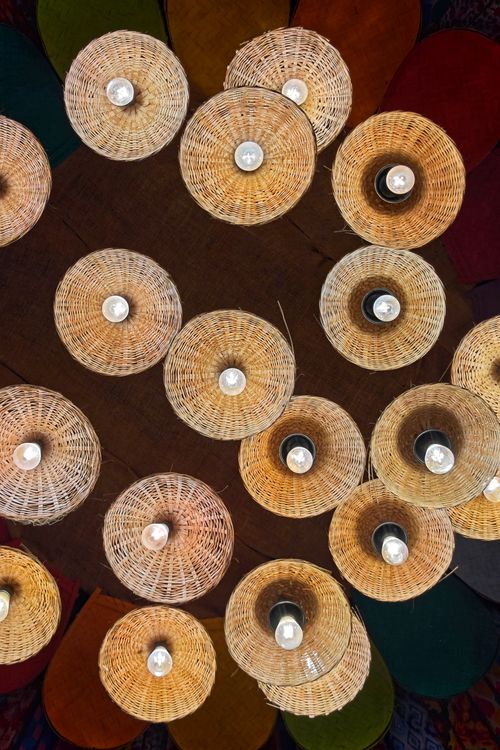Free Intricate wicker light fixtures captured from above, displaying creative design and warm tones. Stock Photo