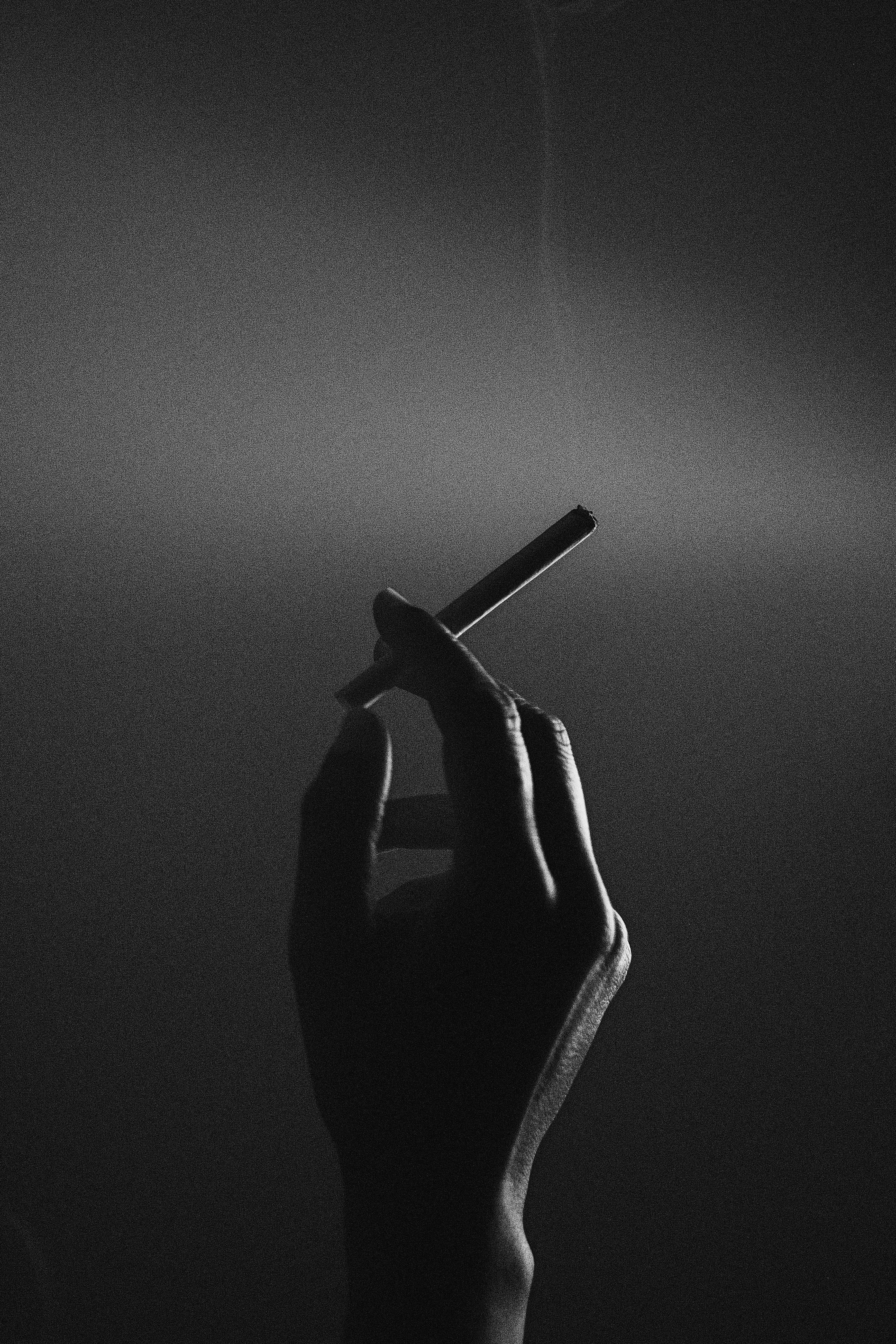 cigarette in hand black and white sketch cigarette drawing Stock Photos & Images Man holding cigarette in hand