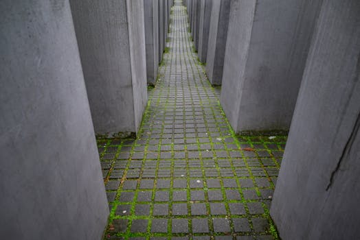 Concrete columns at Holocaust Memorial in Berlin, Germany, evoking solemn remembrance.