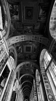 Elegant black and white arches with intricate details and classic artwork.