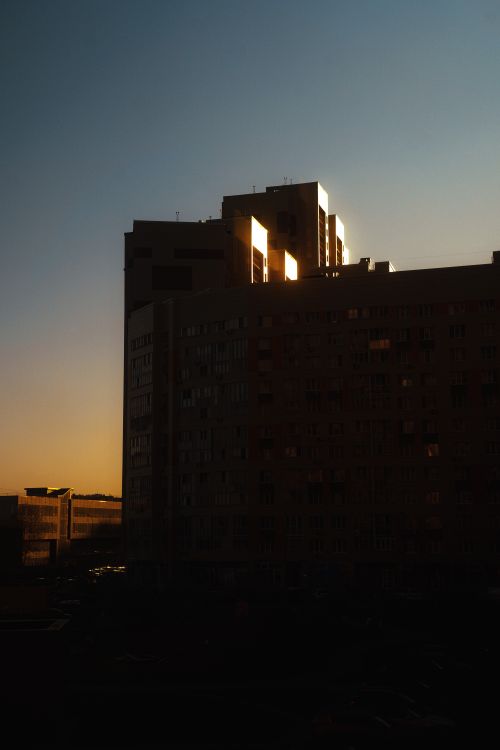 Free Dramatic urban skyline silhouette during sunset with a modern skyscraper. Stock Photo