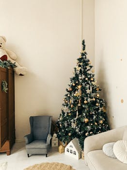 Warm living room decorated for Christmas with tree and festive ornaments.