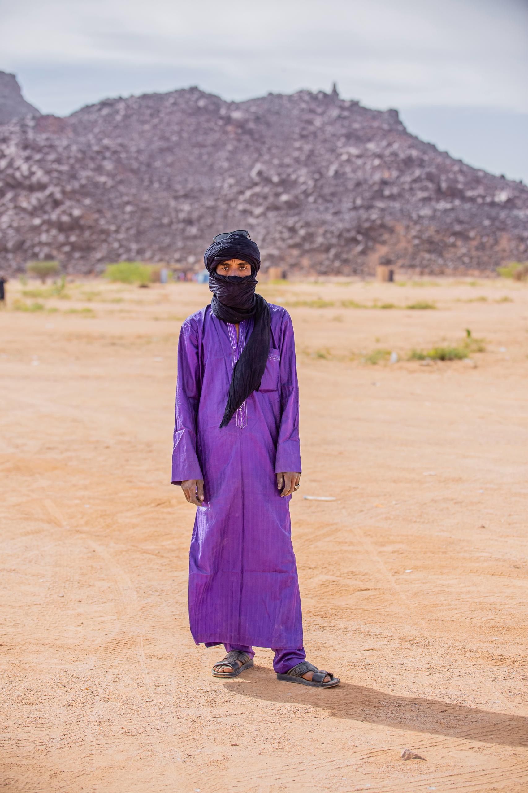 Man in Traditional Attire in Desert Landscape · Free Stock Photo
