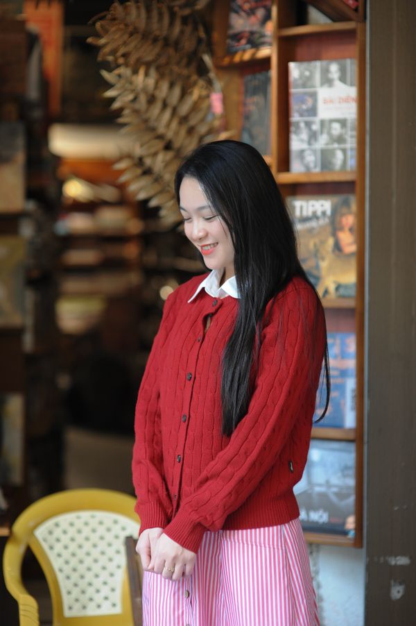 Woman in a red cardigan with jeans