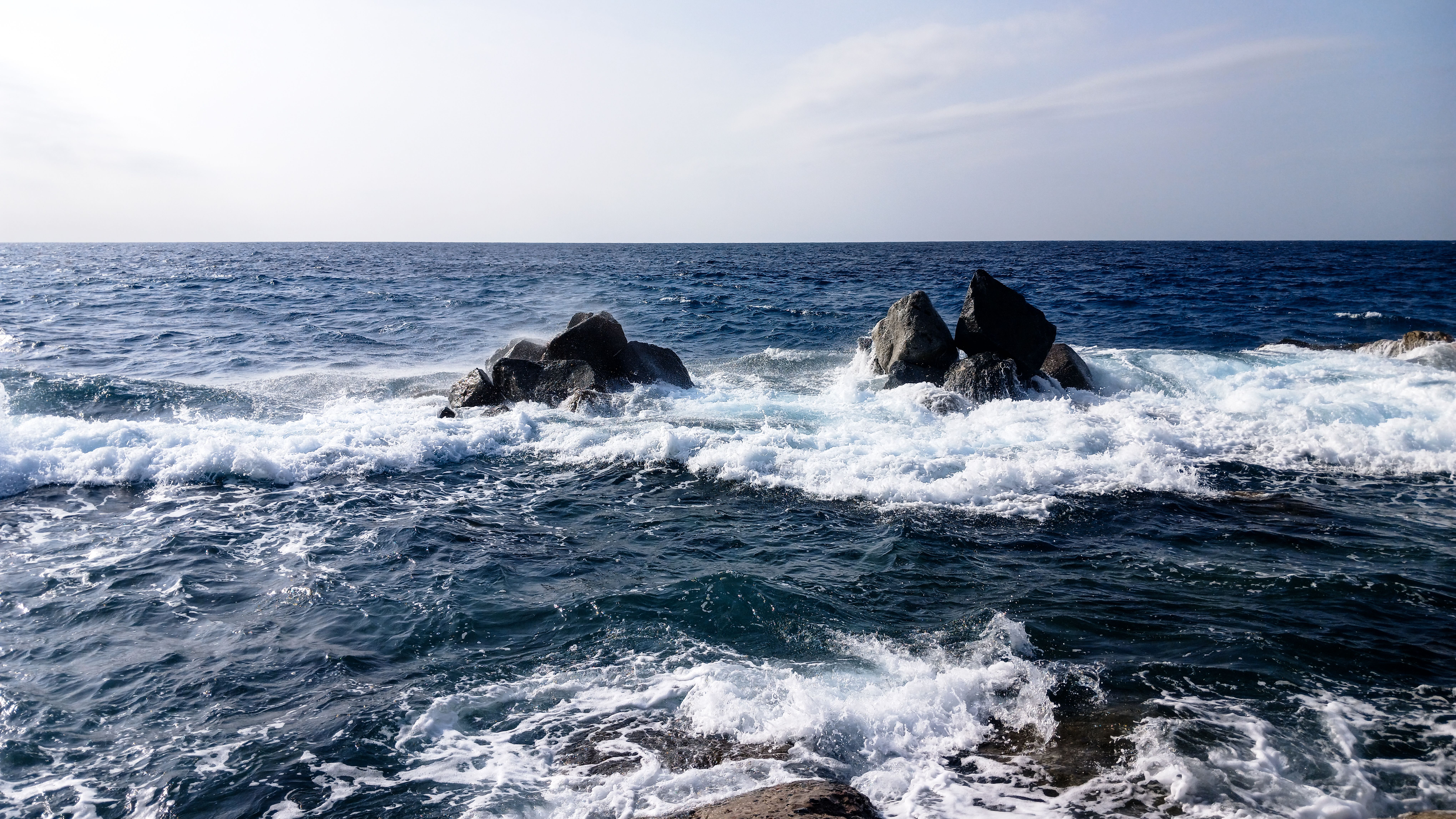 Dramatic Ocean Waves Crashing Against Rocks · Free Stock Photo