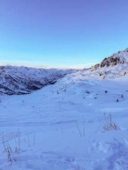Snowy mountain landscape at sunrise in Isola, Provence-Alpes-Côte d'Azur, France.