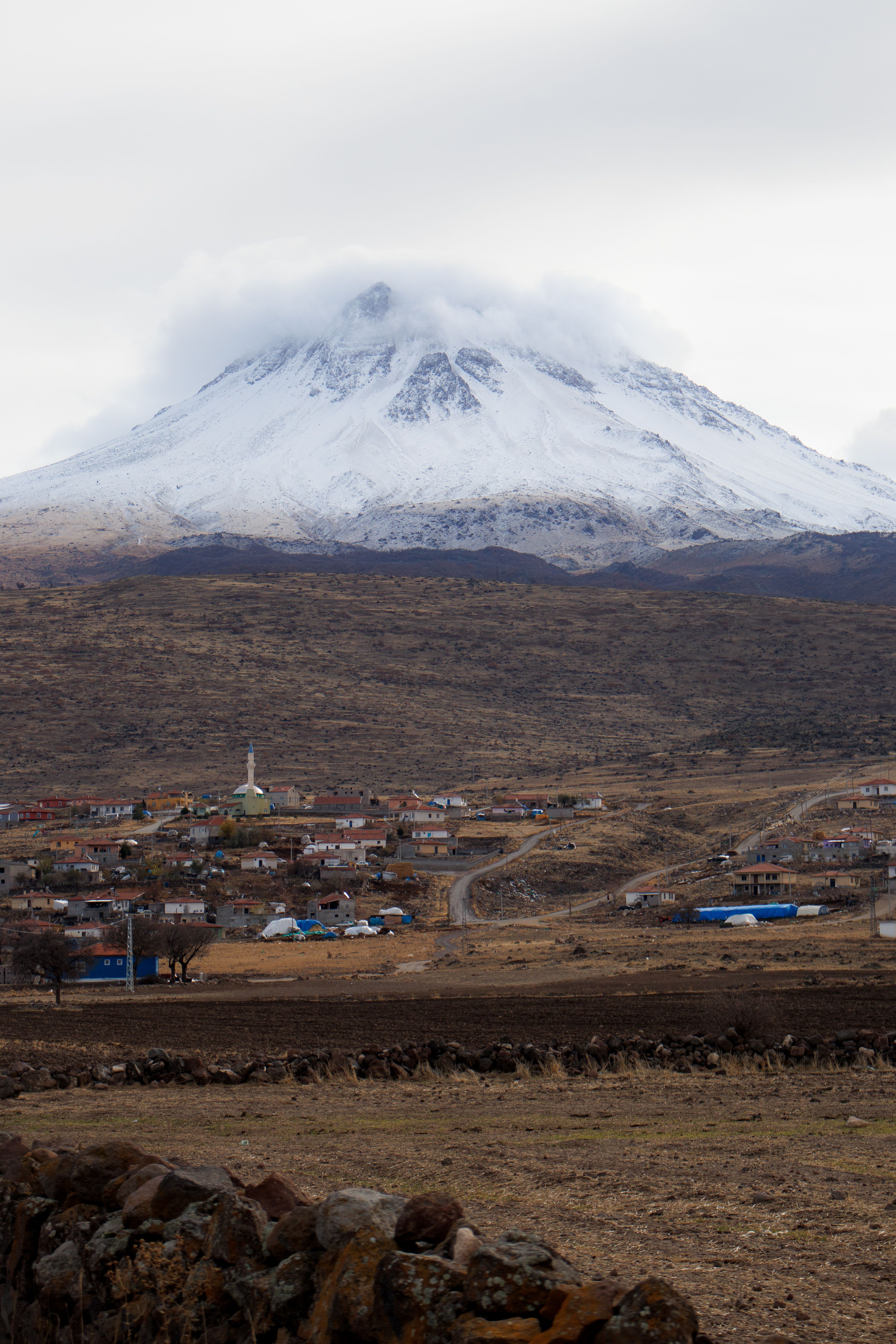 Snow-Capped Volcano with Rural Village View · Free Stock Photo