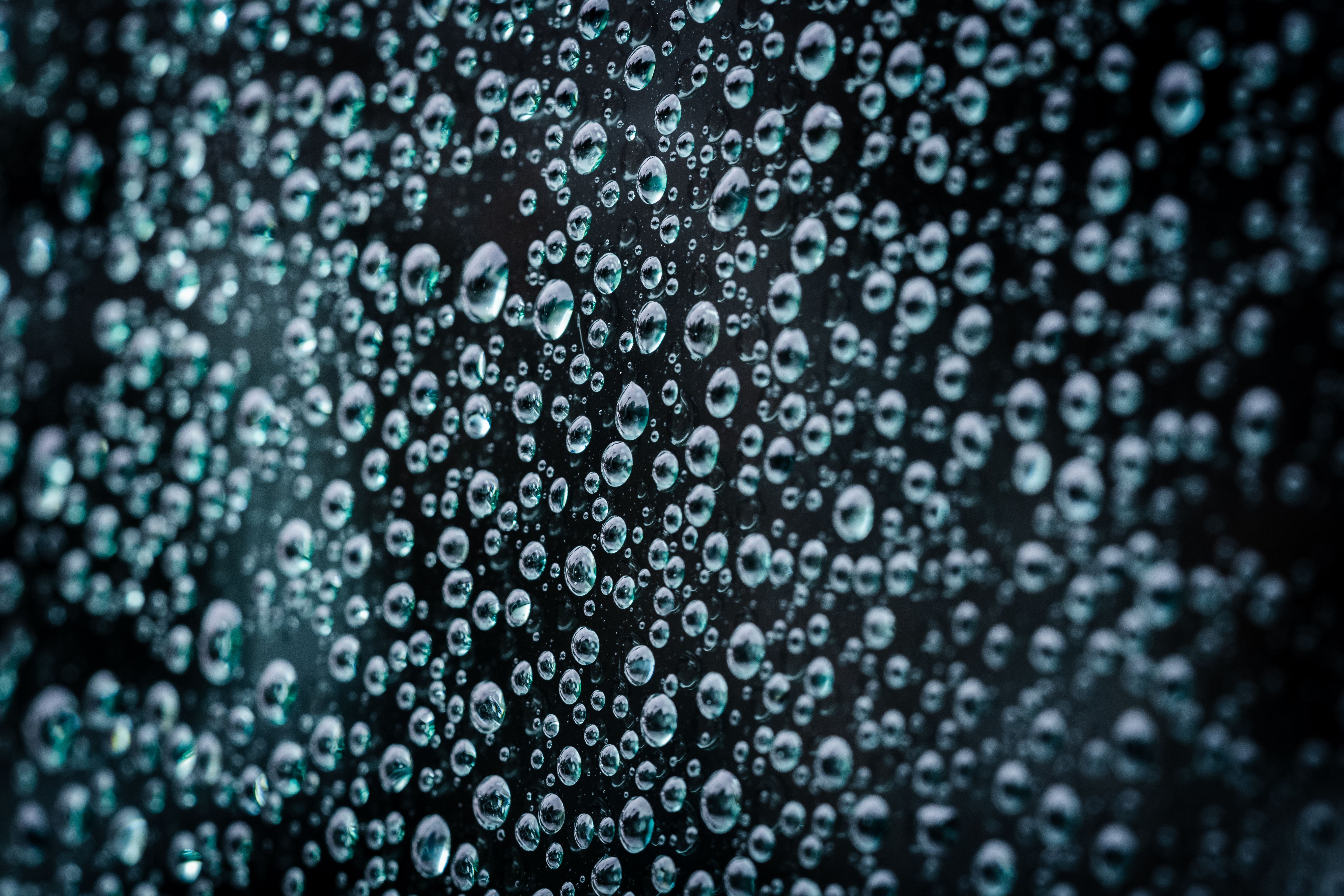 Close-up macro photograph of water droplets on a glass surface creating a textured pattern.. pexels, close, macro