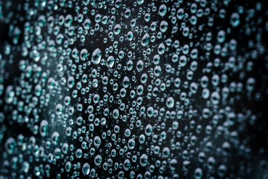 Close-up macro photograph of water droplets on a glass surface creating a textured pattern.. pexels, close, macro