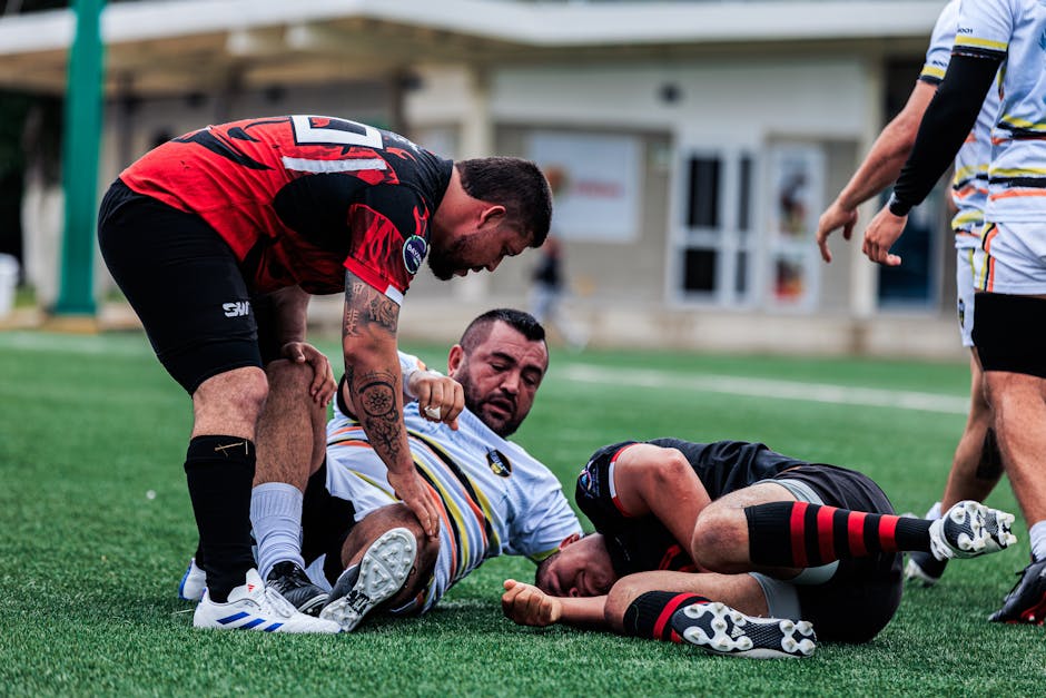Three male rugby players engaged in a dynamic match on outdoor field.