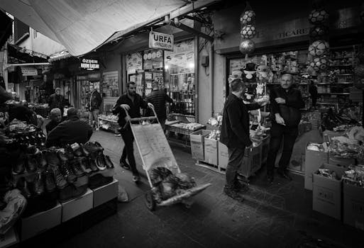 Capturing the bustling atmosphere of an Istanbul street market in black and white.