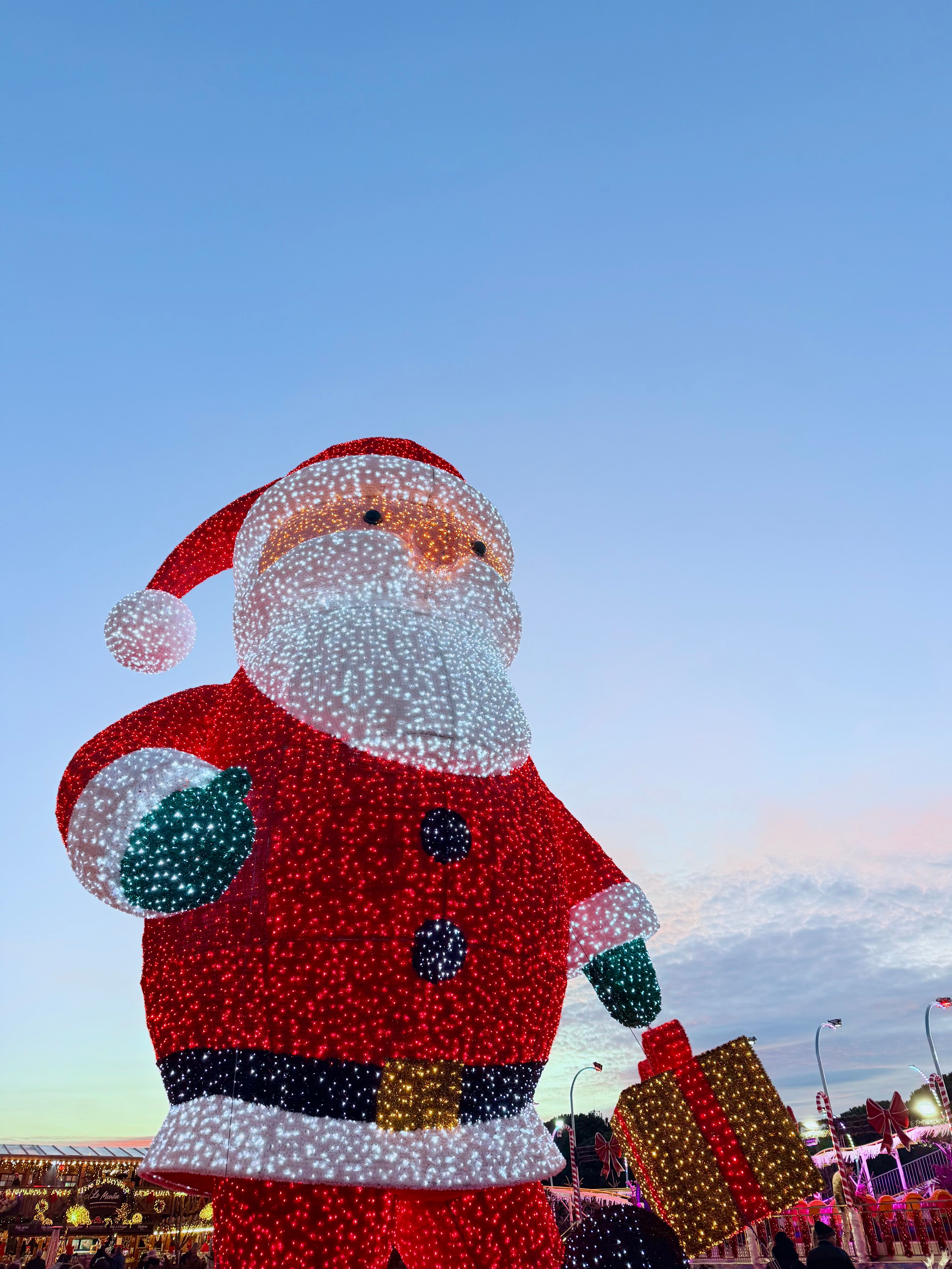 Giant Illuminated Santa Claus Display at Dusk · Free Stock Photo
