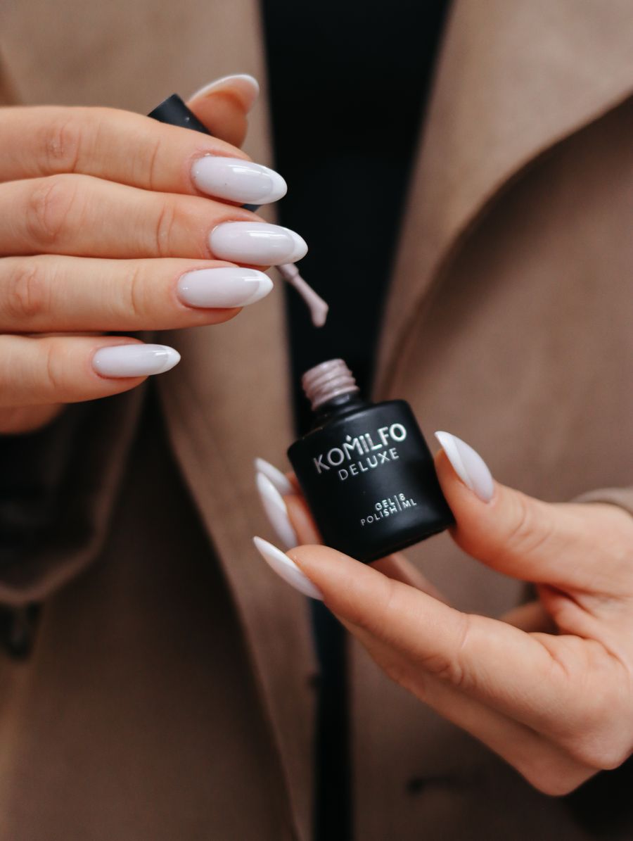 Nude gel polish manicure close up
