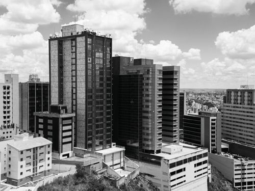 Free Dramatic black and white photograph capturing the urban skyline of Belo Horizonte, Brazil. Stock Photo