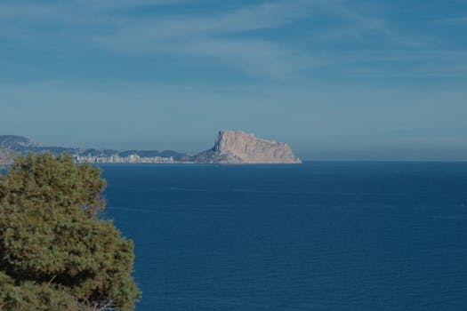 Captivating view of Peñón de Ifach over the Mediterranean Sea in Comunidad Valenciana, Spain.