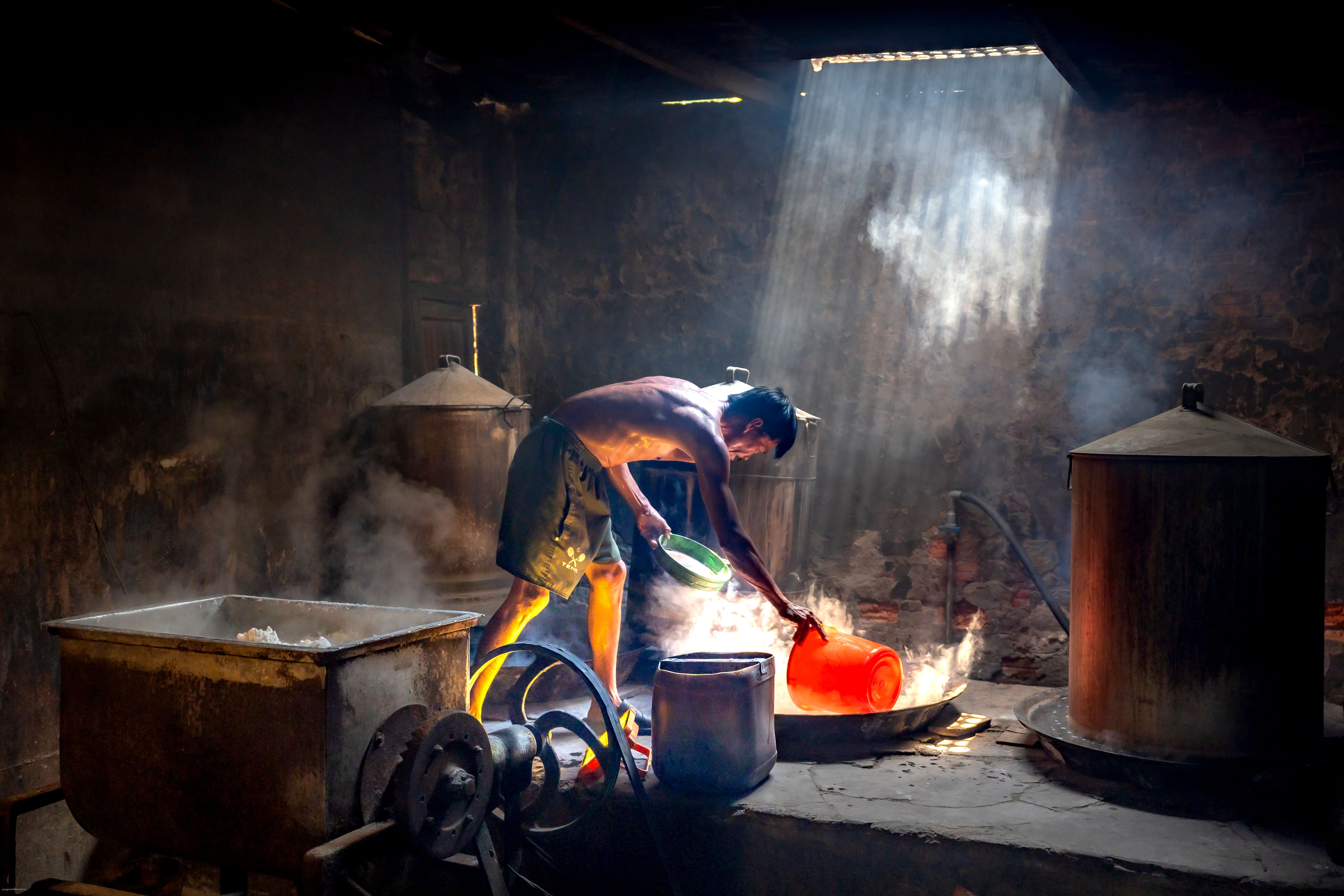 Man Working in Traditional Industrial Setting · Free Stock Photo