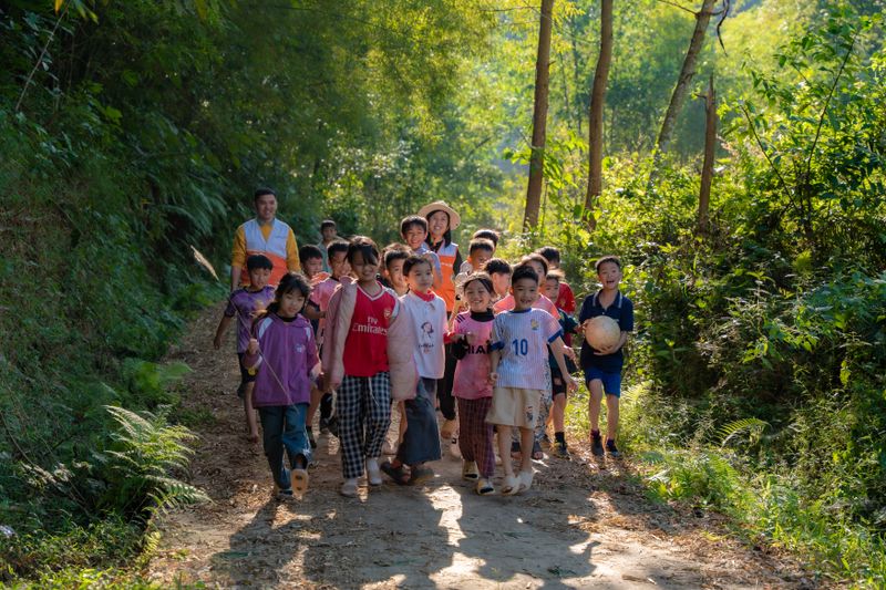 Children exploring outdoors at golden hour