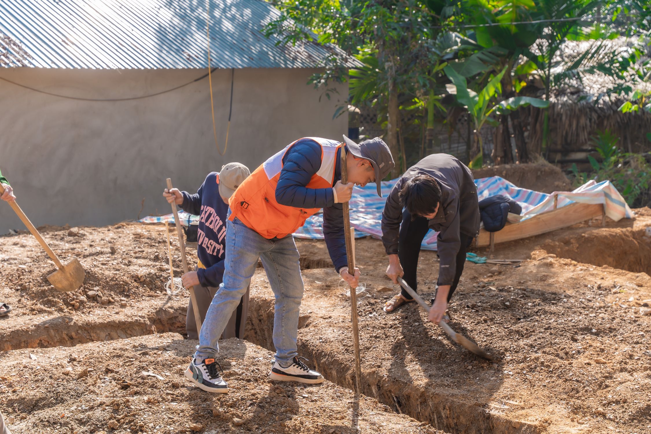 Digging By Compress Construction Workers Digging Foundation Ditches Outdoors · Free Stock Photo