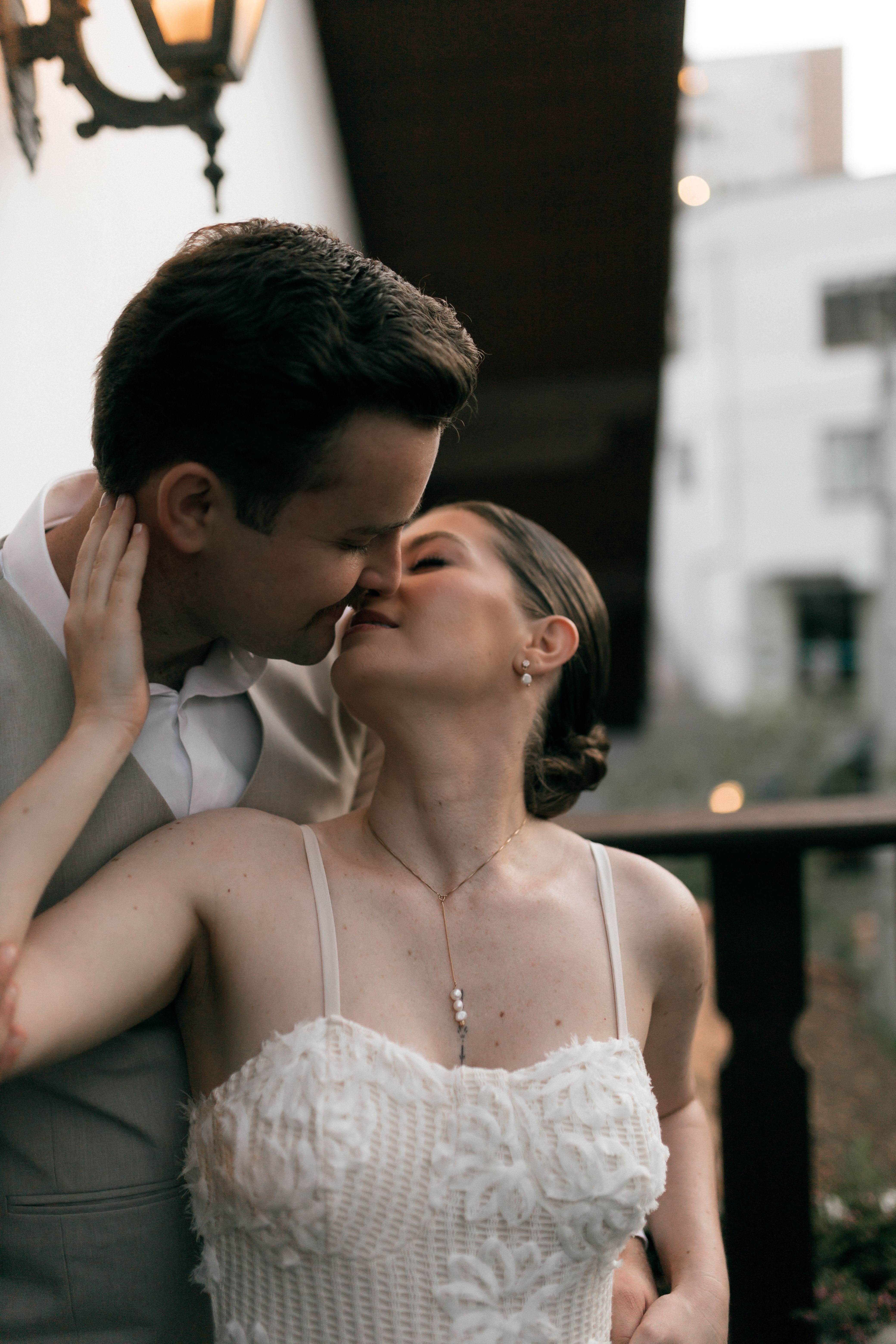 Bride and groom share a tender kiss on their wedding day.