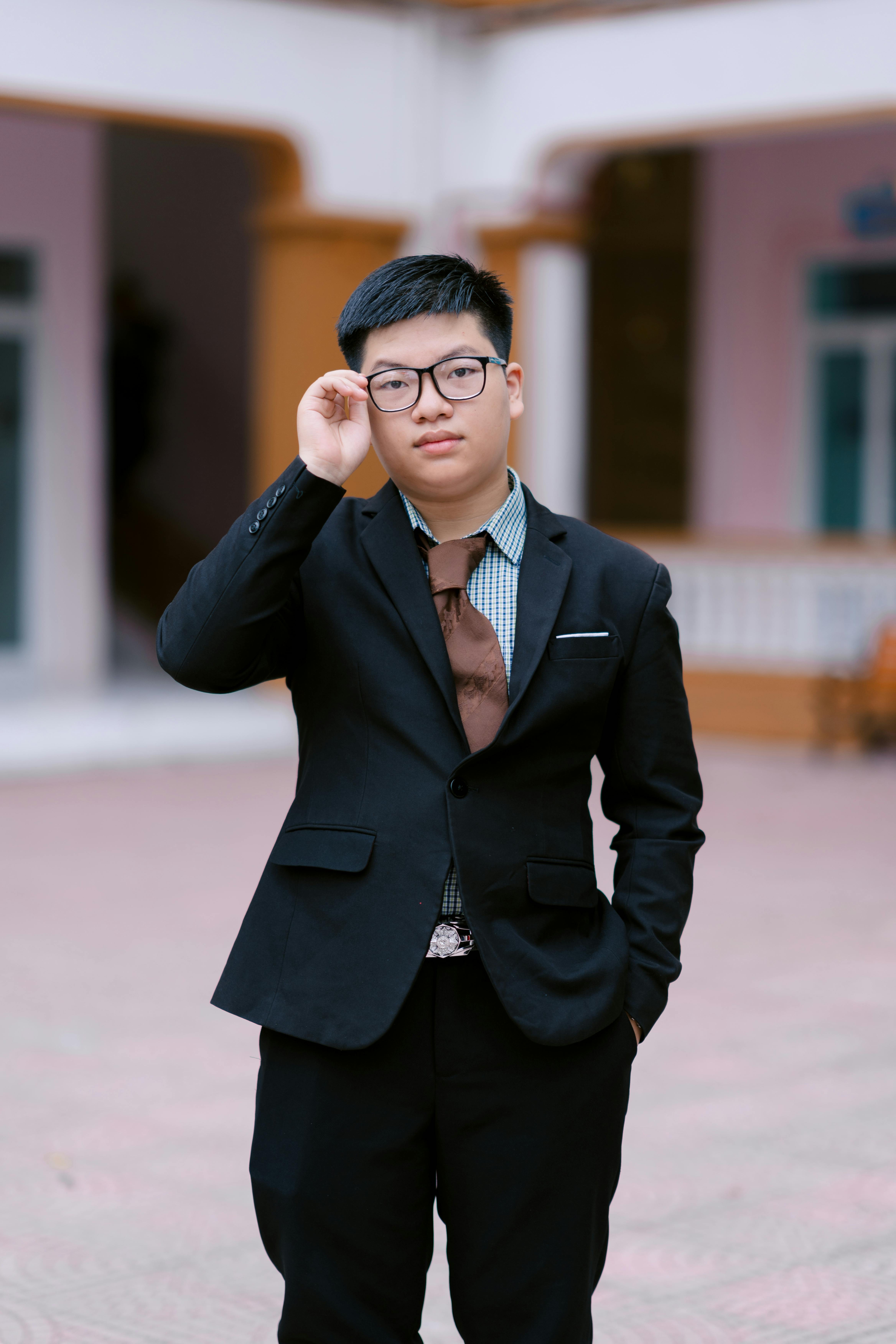 Confident Young Man in Formal Attire Outdoors