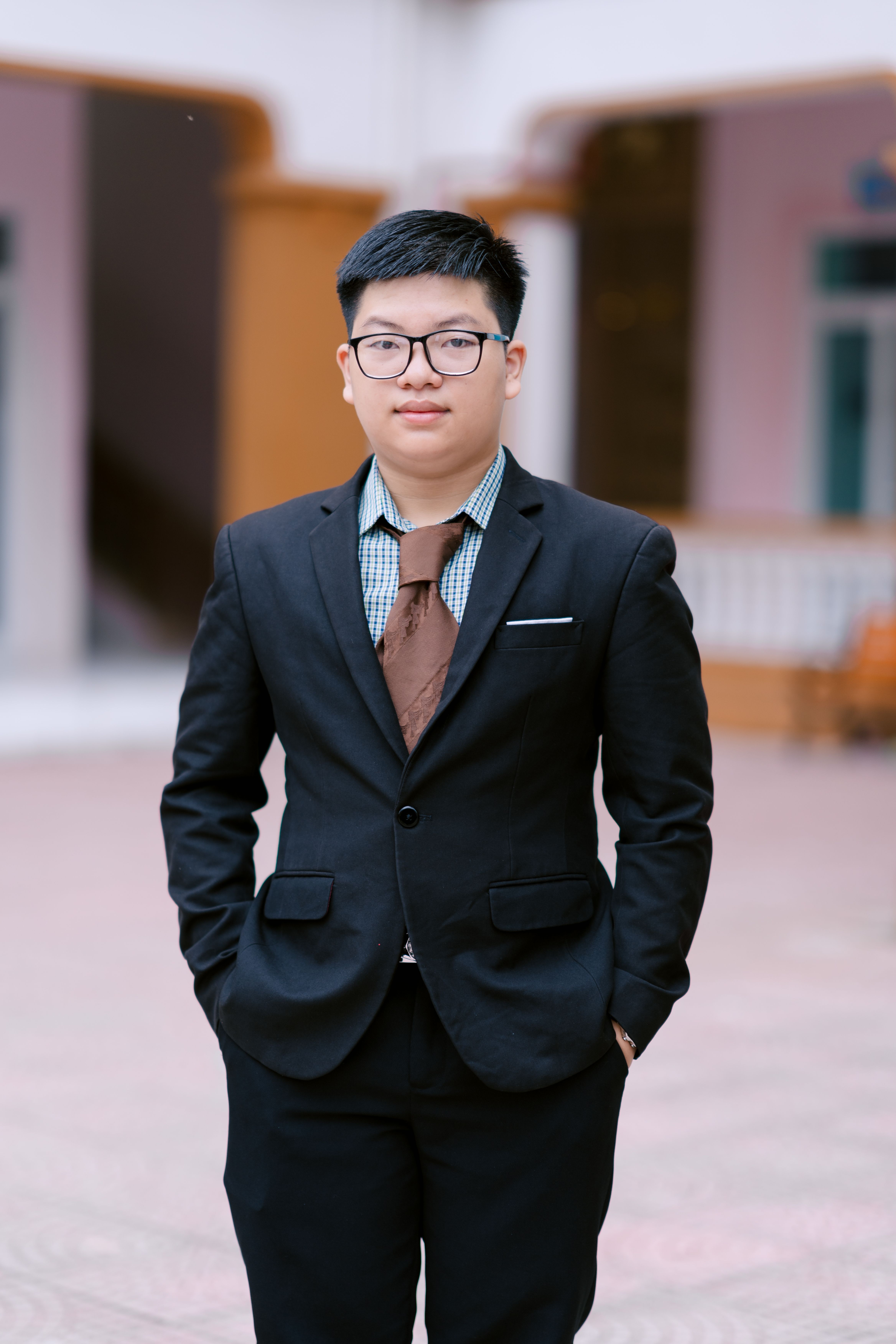 Confident young man in formal attire outdoors. Perfect for business or career-related themes.