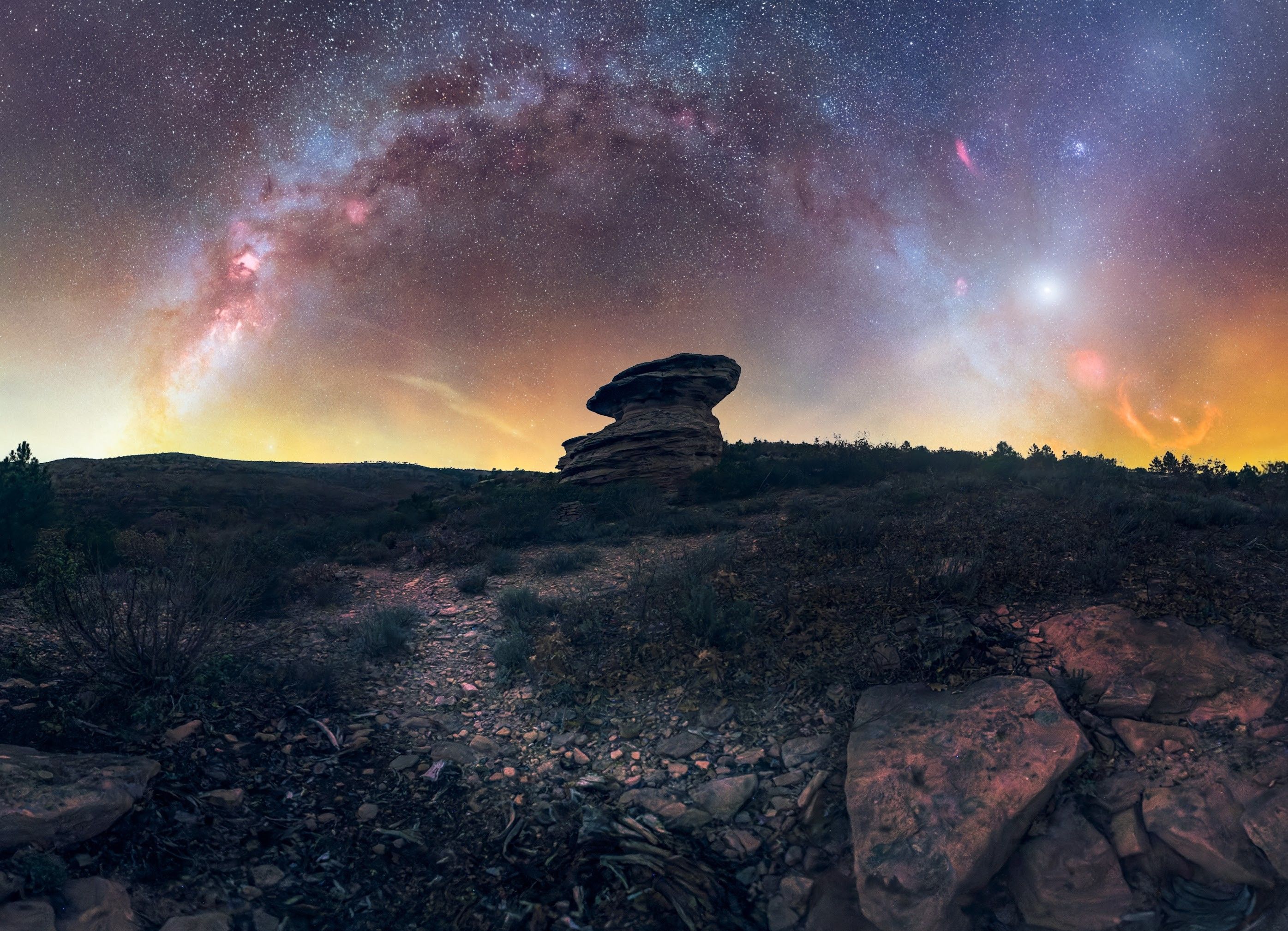 Stunning Milky Way Arch Over Rocky Terrain at Night · Free Stock Photo