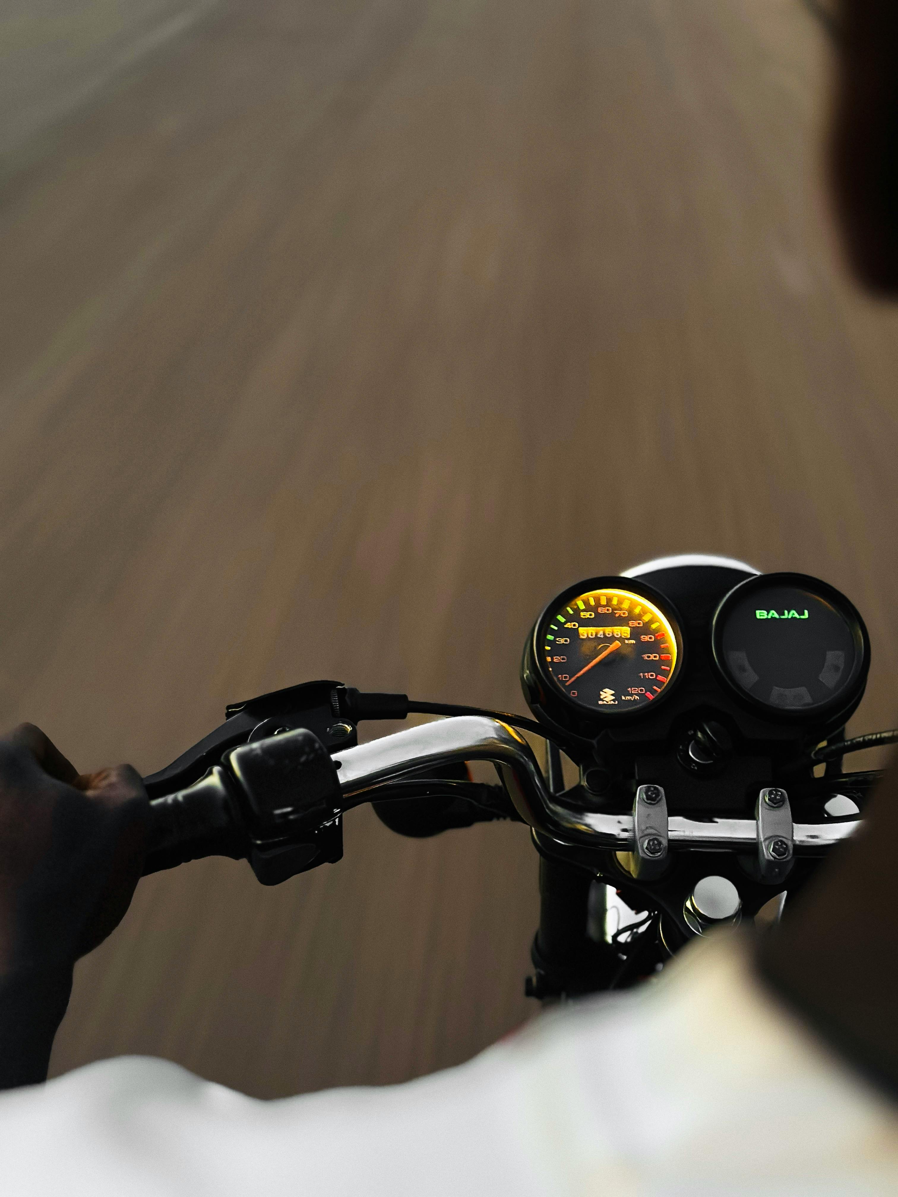 Free POV of a person riding a motorcycle at speed on an open road. Stock Photo